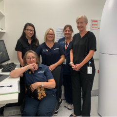 Sunshine Coast staff standing next to imaging machine